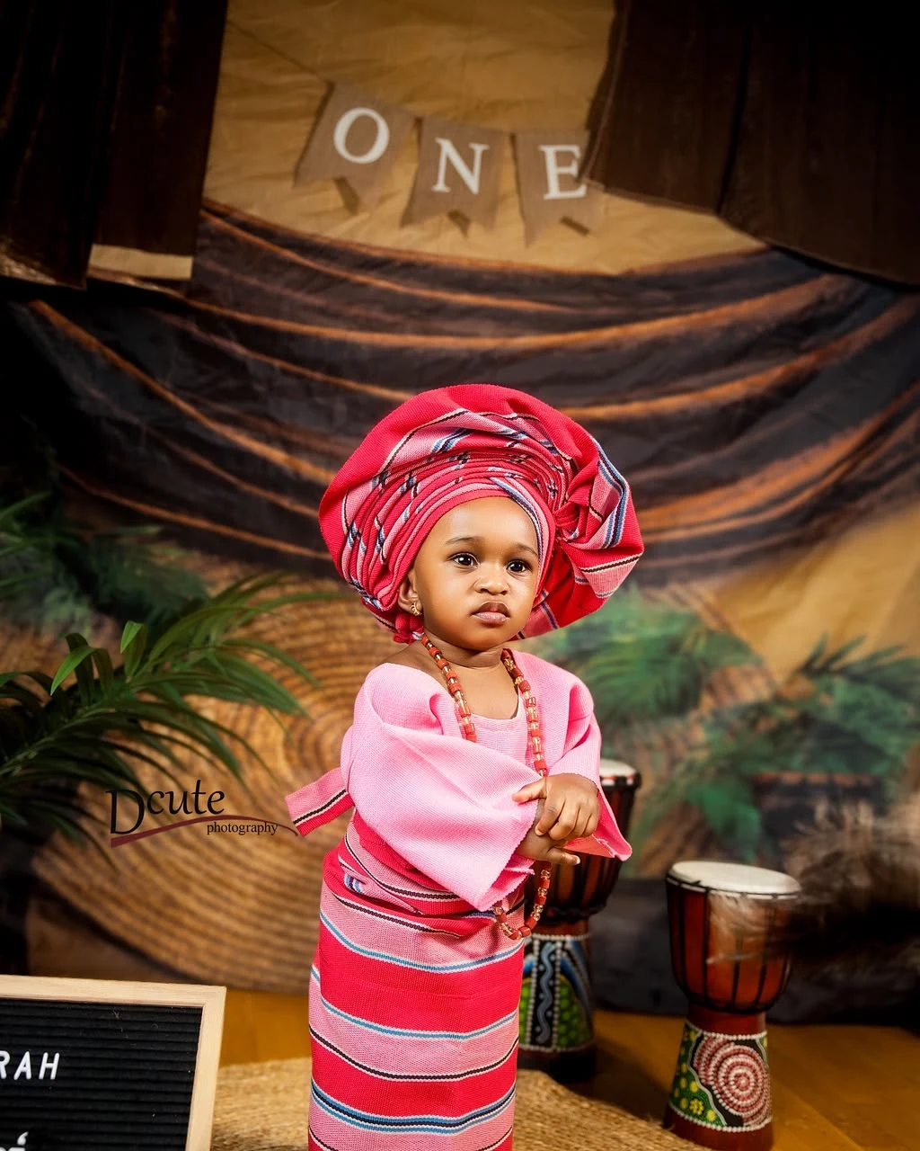 Noorah wearing beautiful pink traditional attire and gele